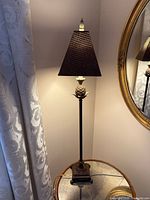 Full view of lamp showing shade, pineapple motif and height proportion