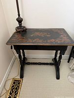 Top view showing floral painting on dark surface