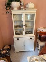 Front view of white Knechtel hutch showing full structure and shelves