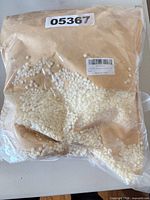 Full view of resealable bag containing soy wax pellets