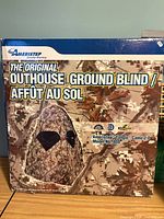 Front of retail box showing Ameristep outhouse ground blind image and branding