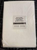 Front view of sealed white Bellisimo flannel-backed tablecloth