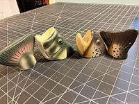 All four ceramic fish head and tail shakers lined up