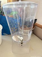 Full view of dispenser on stand with lid and spigot