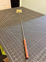 Full view of 41 in roasting fork on cutting mat