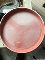 Interior top view of red plastic heated basin