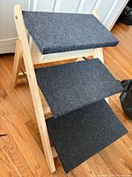Full view of three-step wooden pet stairs