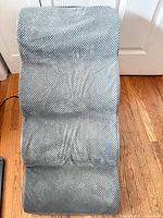 Top view of gray four-step pet stairs showing textured cover and overall form