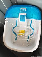 Top view of Homedics foot spa showing basin, massage nodes, power cord