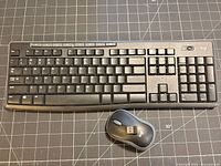 Top view of full wireless keyboard and mouse with receiver