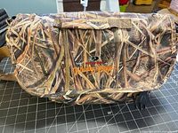 Overall view of Mossy Oak camo shoulder bag with logo on flap