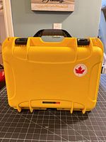 Front of Nanuk 920 yellow case with Canadian emblem sticker