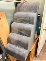 Front view showing all five gray fabric steps