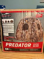 Front of boxed Comfort Zone Predator hunting blind showing product image and specifications