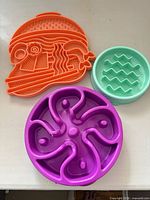 Three feeders showing colours and designs