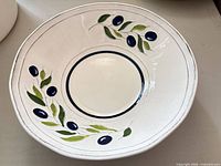 Top view showing full olive branch pattern and bowl shape