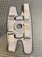 Full view of knee brace showing size, shape, straps and patella opening