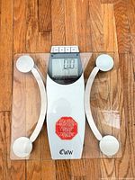 Full view of WW tempered glass digital bathroom scale on wood floor