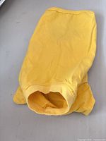 Folded yellow dog shirt front side