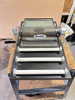 Top view showing full AccuCut roller cutter with tray and support rollers