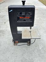 Full front view of Black & Decker band saw showing table, housing and label