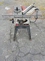 Full view of Craftsman 9 in table saw on stand showing front controls and overall wear