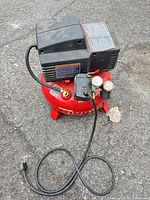 Full view showing entire compressor, gauges, handle, cord