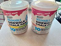 Front view of two RoseArt refill tubs showing product name and '10 individual refill color packs'