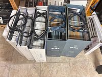 Five sample binders with handles aligned vertically, showing Altex and SheerWeave branding