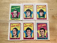 Front covers of all six booklets showing player names and numbers