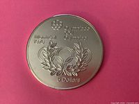 Reverse showing Olympic emblem, Montreal 1976, laurel wreath, 5 Dollars