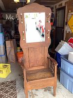 Front view showing mirror, coat hooks, bench seat