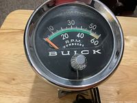 front view showing BUICK logo, scale 0-60 RPM x100