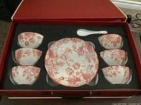 Set in open presentation box showing all pieces