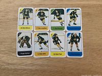 Front view of all eight cards showing player images and numbers