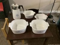 Group shot of all four casseroles and coffee pot