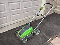 Full mower showing handle, deck, wheels