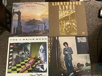 Front covers of all four albums laid out