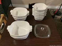 Group shot of all casseroles and lid on table