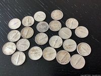 All 23 1967 Canadian dimes arranged on tabletop