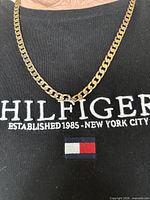 Necklace worn to show length and link style