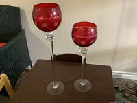 Front view of both candle holders showing height difference and design