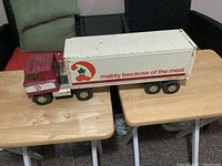 Side view of complete truck showing Dominion livery and length