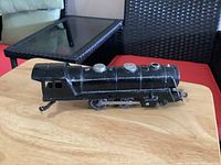 Left side view of black Marx K398 locomotive on tabletop
