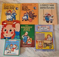 Front covers of seven Raggedy Ann & Andy books showing titles and condition