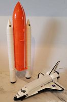 Space Shuttle orbiter, external tank and boosters standing upright