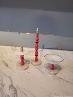 Vanity set showing jewelry stand, marble trinket dish and porcelain bowl dish