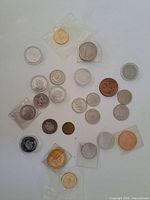 Overview of all souvenir coins laid out showing quantity and variety