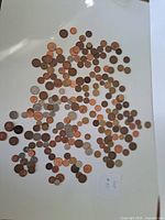 Full spread of assorted world coins on white background