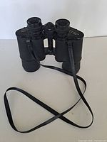 Front view of binoculars with strap